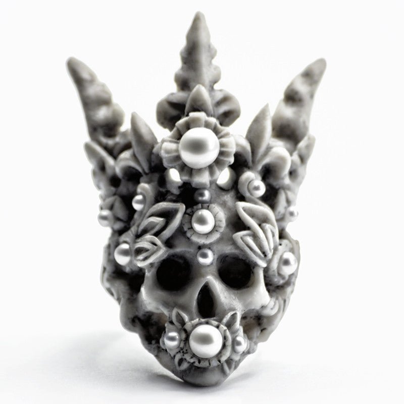Coral Crown Skull ring - gothic ring shaped like a skull in elaborate crown with pearls on neutral background