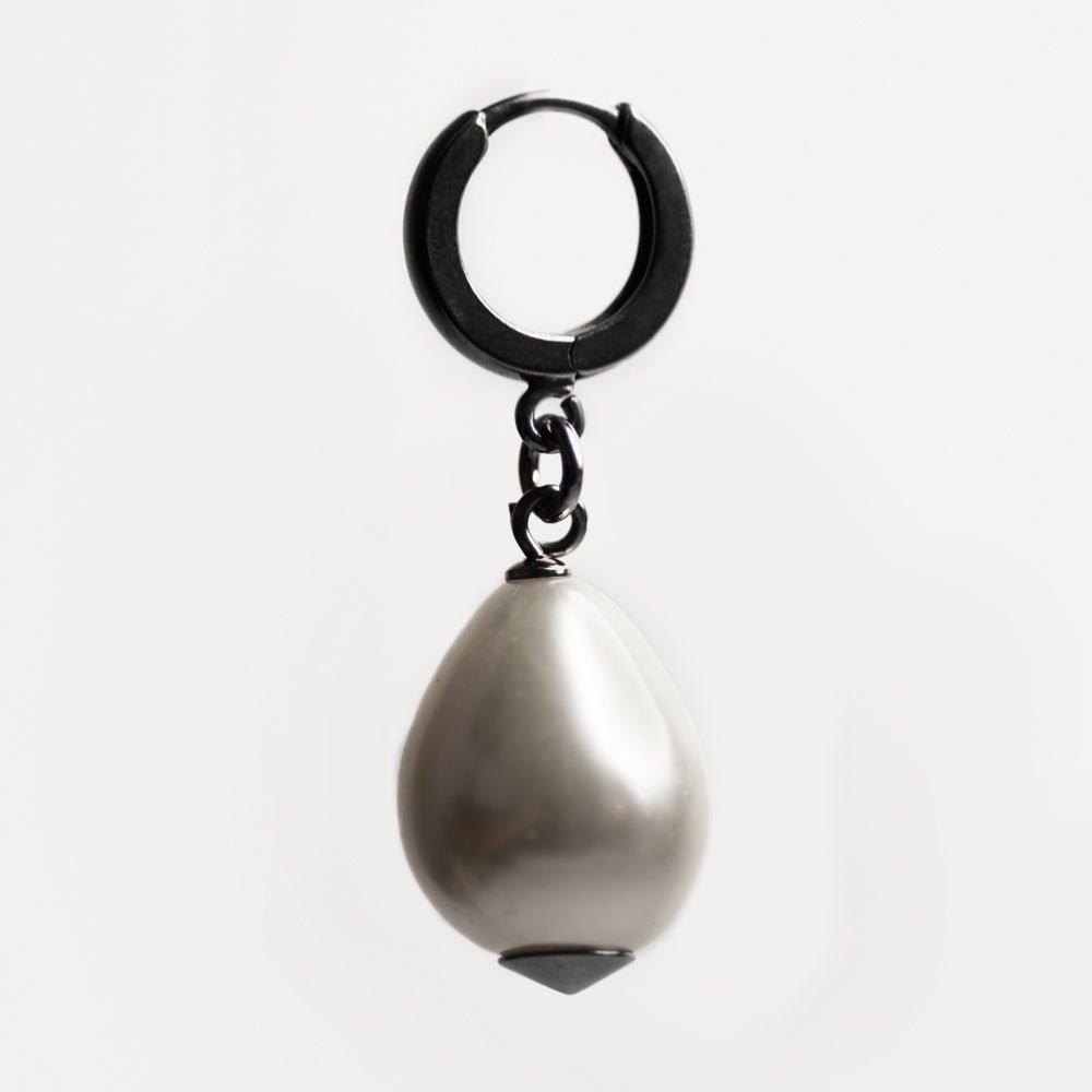 Large pearl earring - placed against white background