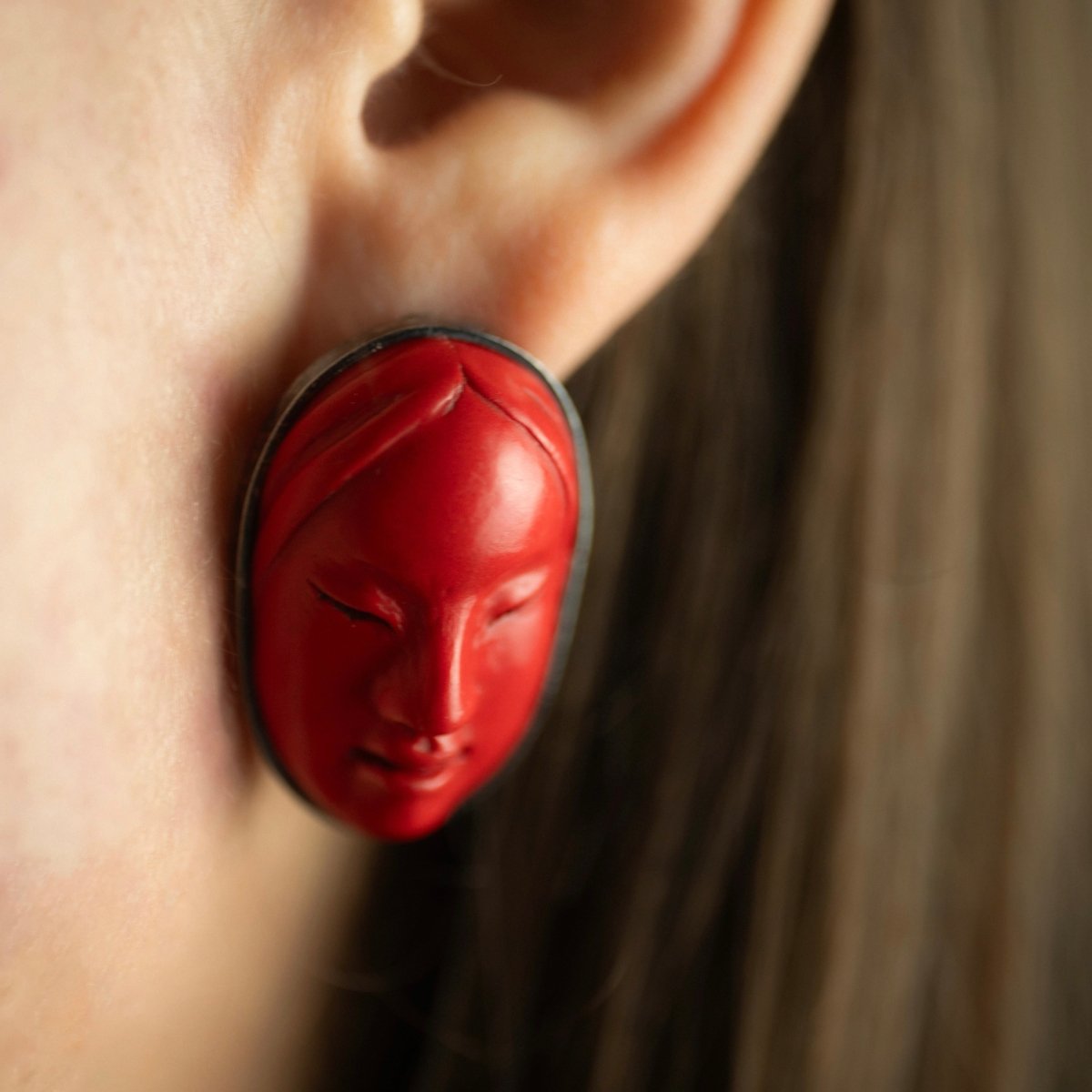 Mask earrings - red variant - fit on a model, close up