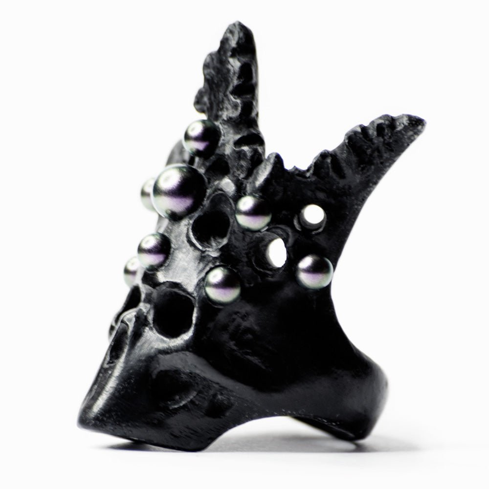 Pearl Crown Skull Ring - black variant - gothic skull ring with siren mythology influence on white surface