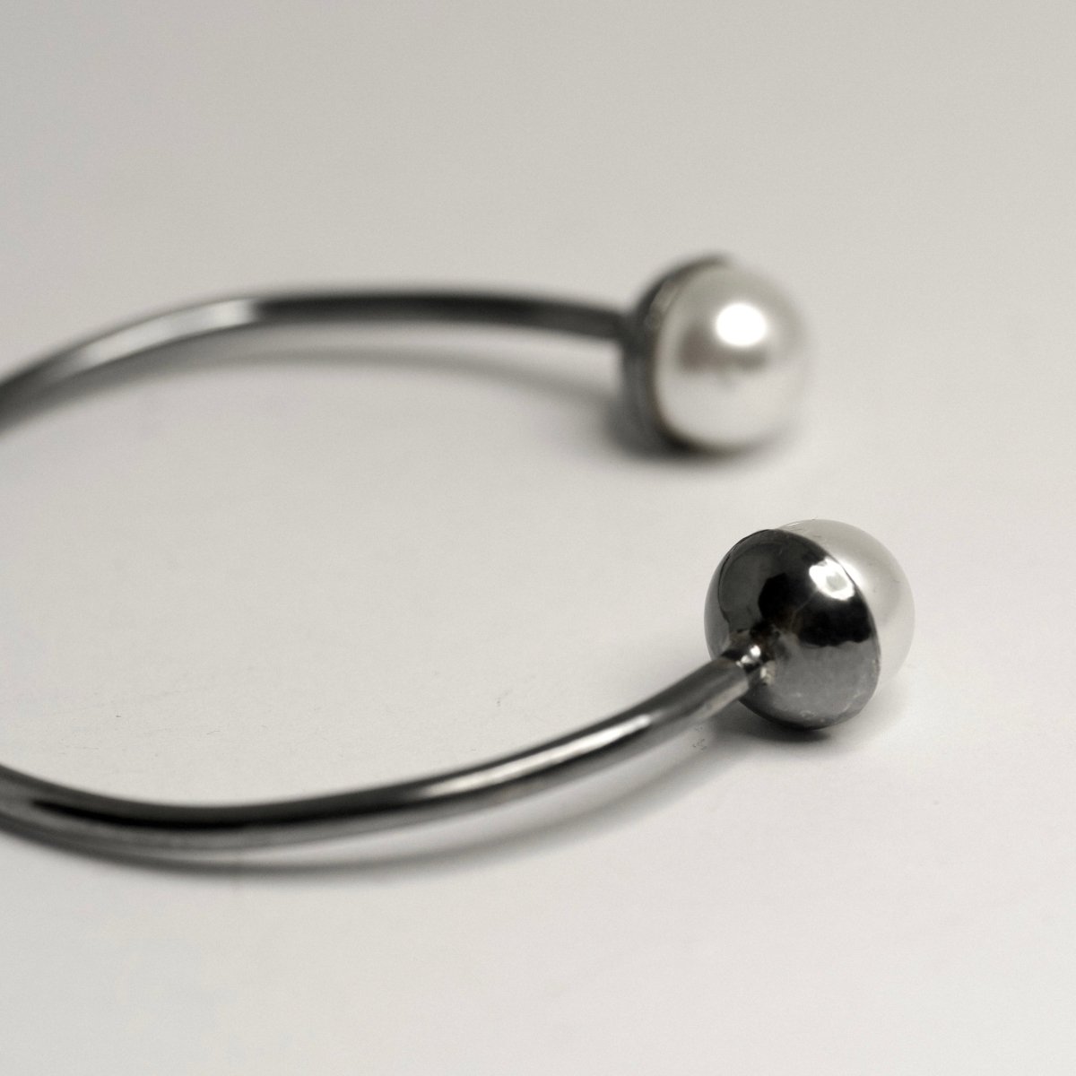 Close-up of glass pearls set in half-dome sterling silver holders