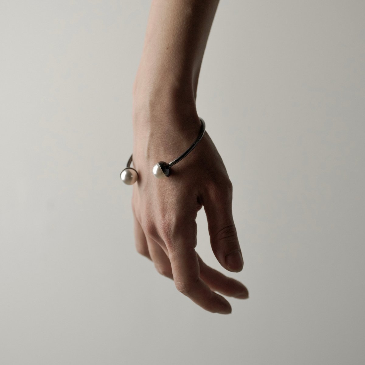 Pearl cuff bracelet worn on wrist showing elegant styling