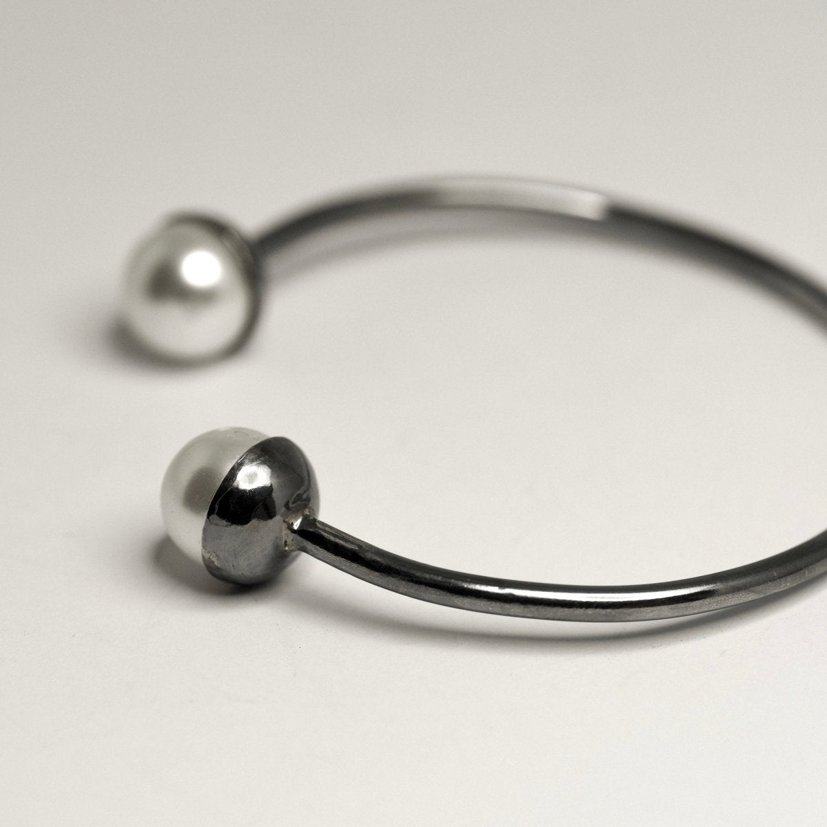 Pearl cuff bracelet with two glass pearls on oxidized sterling silver