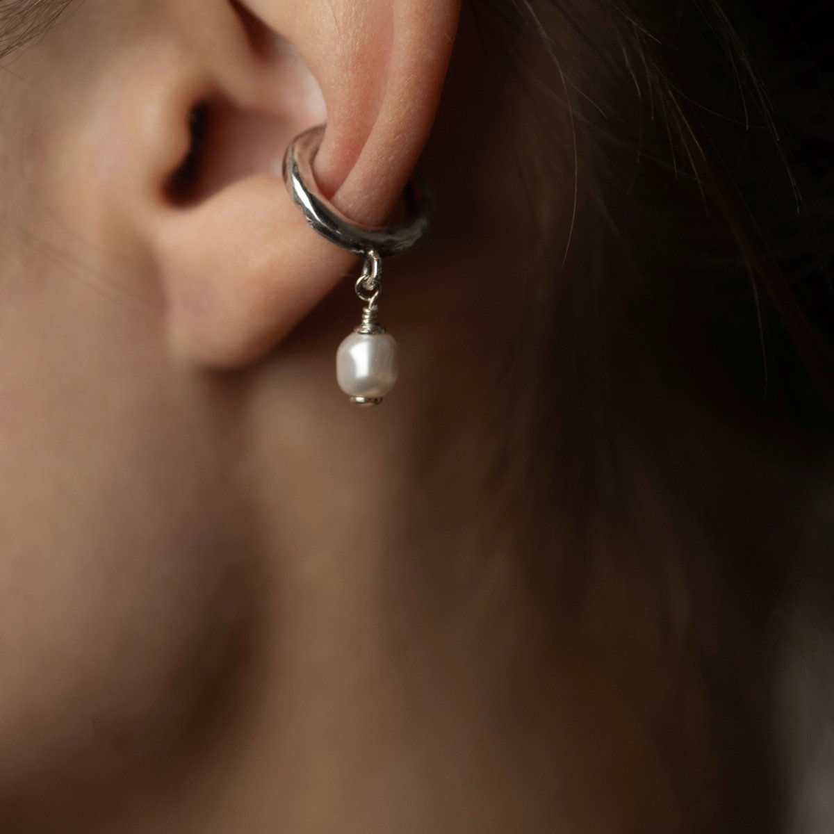 Pearl ear cuff by Macabre Gadgets on a female model, close-up to demonstrate fit and dimensions