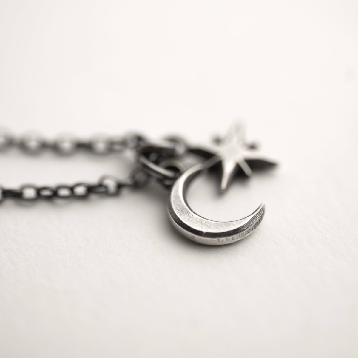 Selene Moon pendant on a white surface