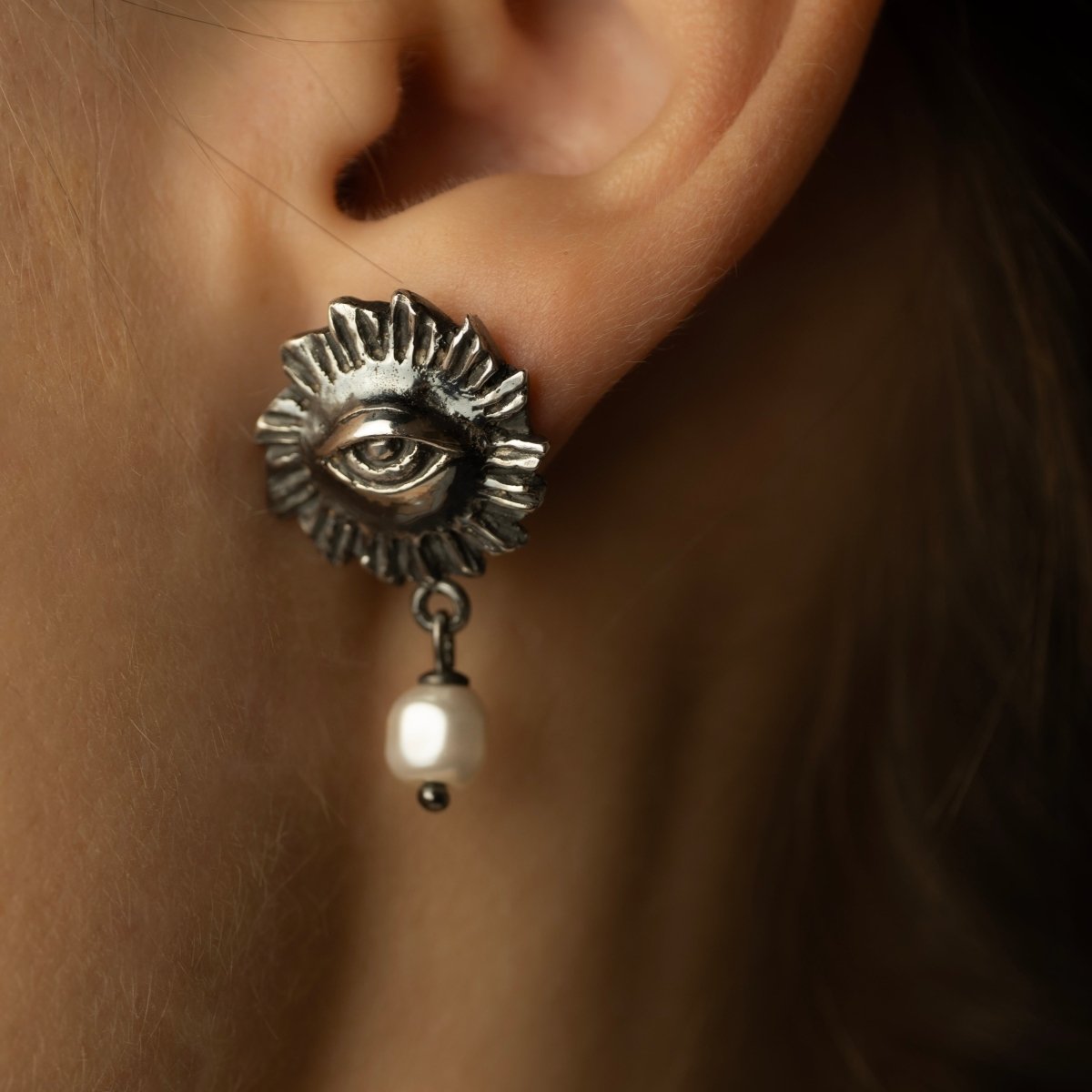 Sirius pearl earring by Macabre Gadgets on female model, close-up on ear to show fit and dimensions