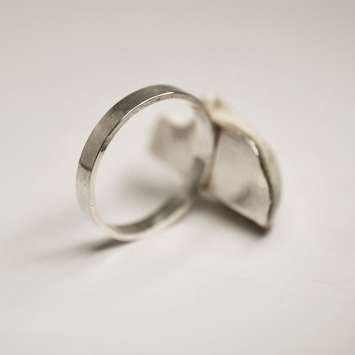 Skull Fragment ring back side view, shows sterling silver plate, which holds the skull