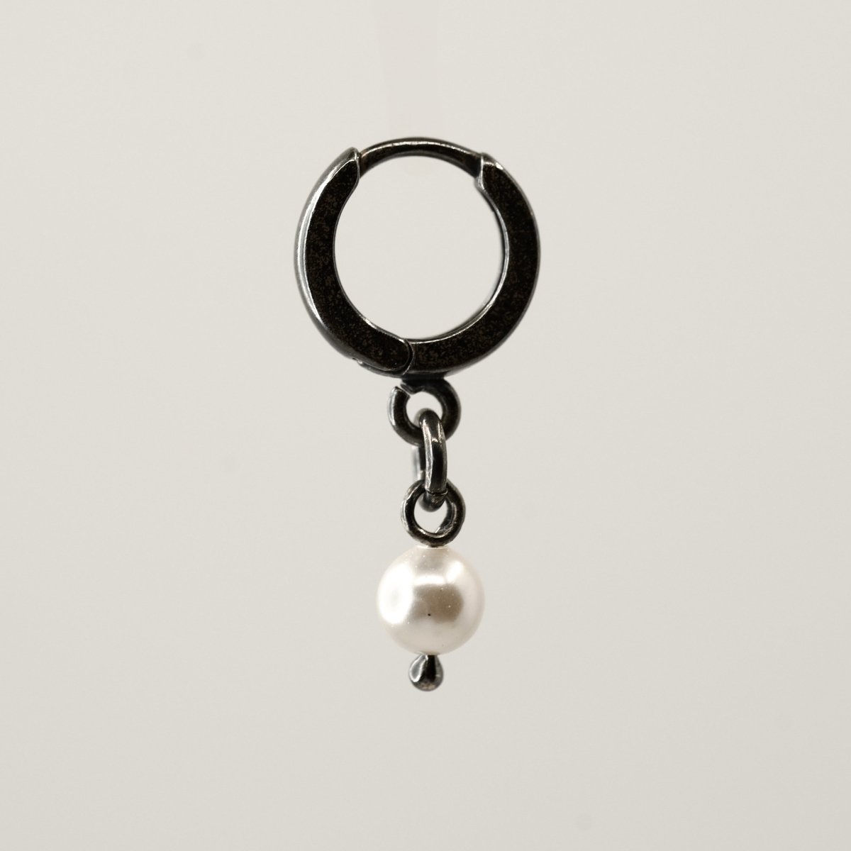 Mini Pearl earring - placed against white background