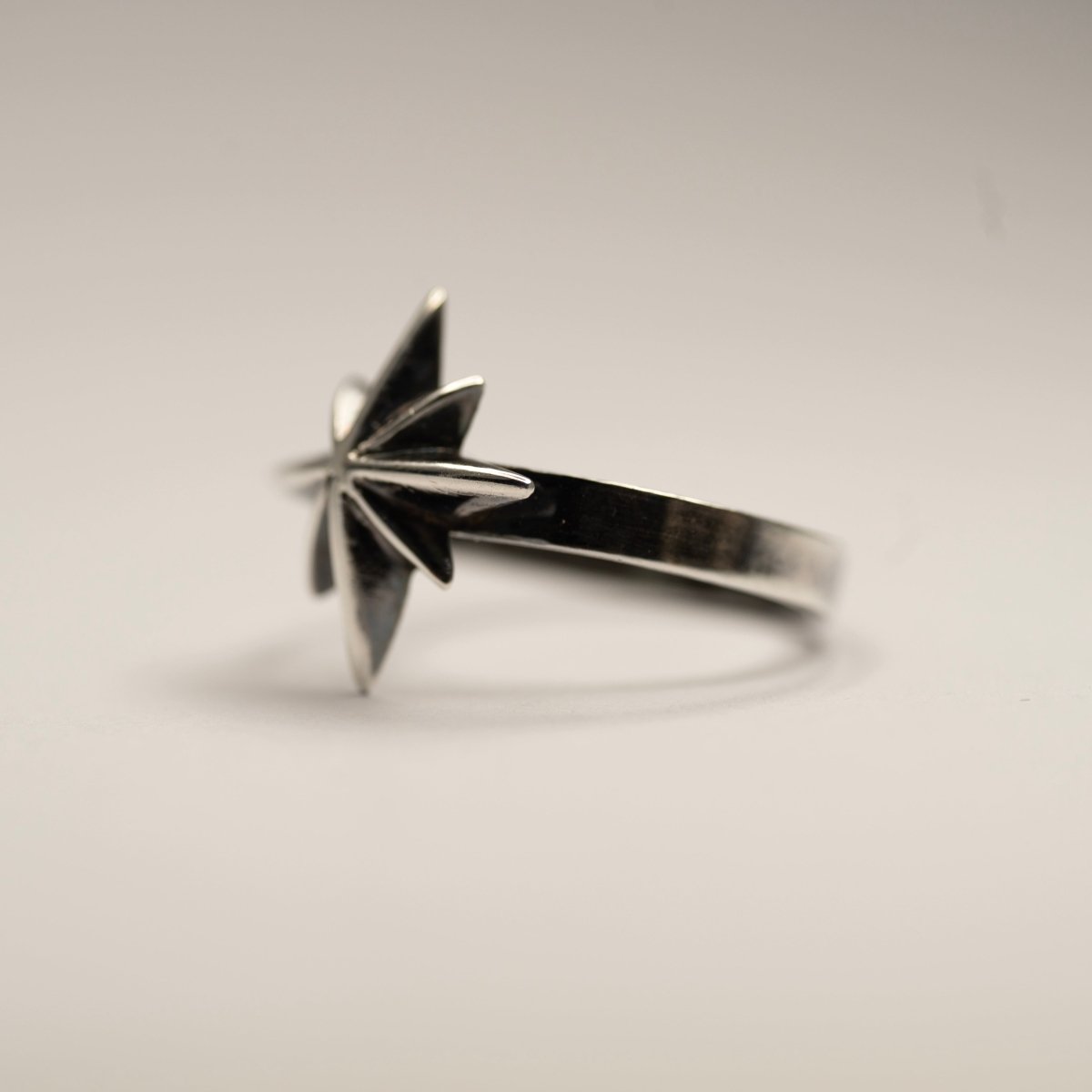 Star ring - semi side view on a white background