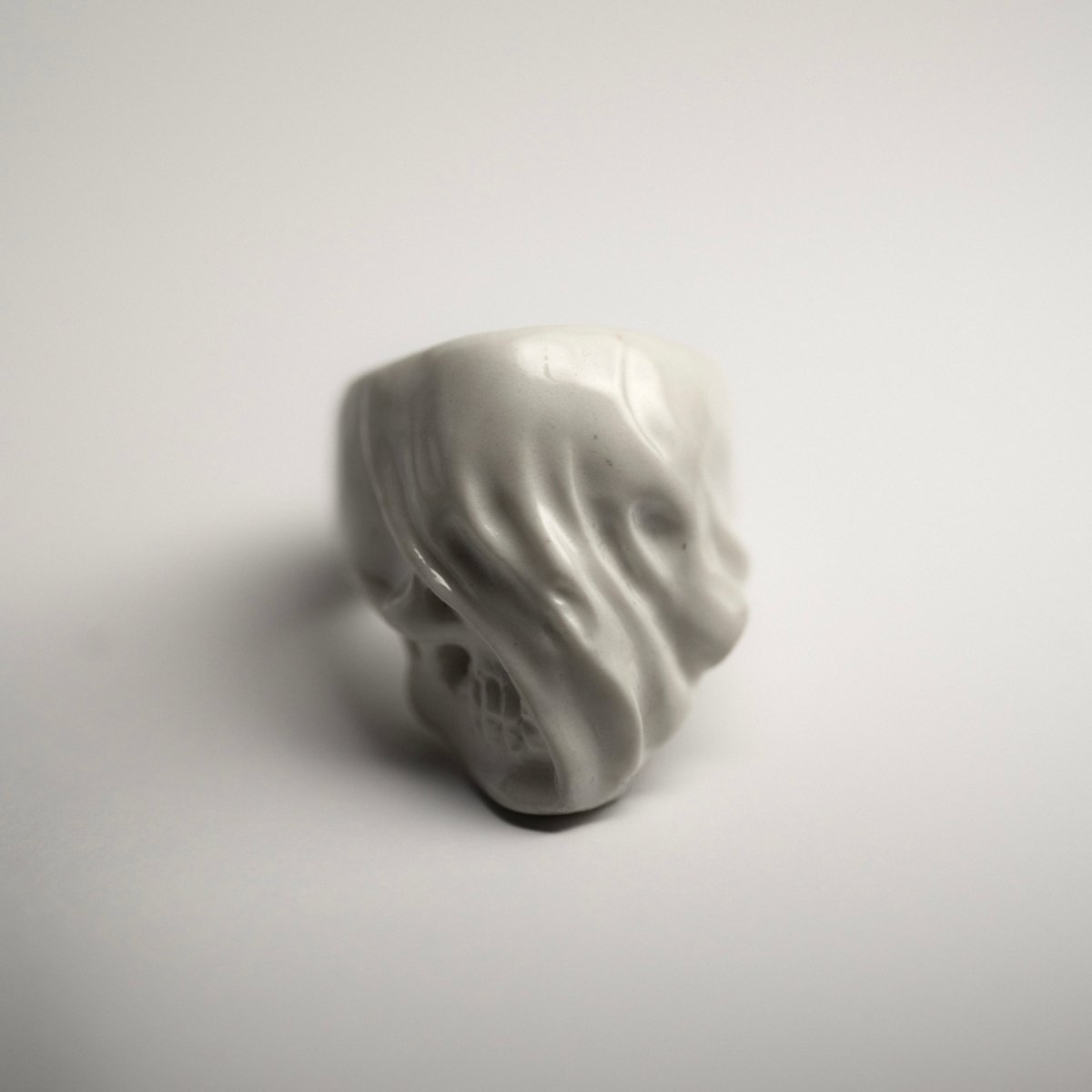 Veiled Skull ring - on a white background, front view, clean product picture