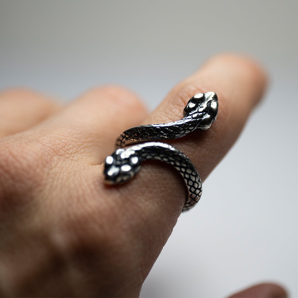 Two Headed Snake ring on a model's hand, close up