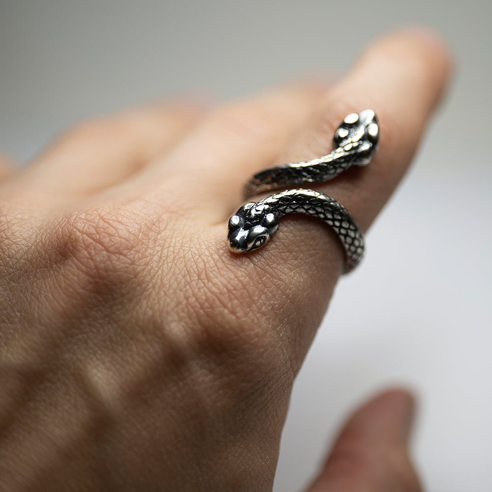 Two Headed Snake ring on a male model's hand (index finger)