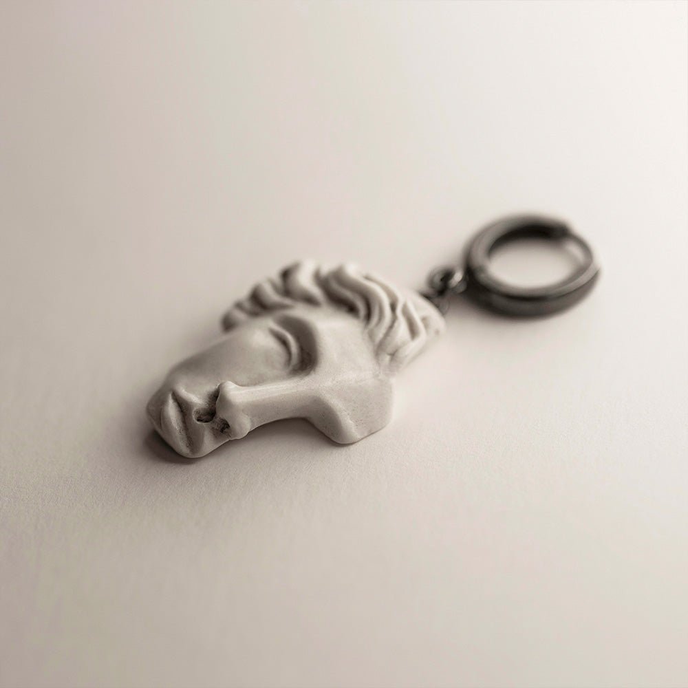Ariadne earring marble sculpted with sterling silver hoop clasp on white surface, handcrafted Greek mythology jewelry
