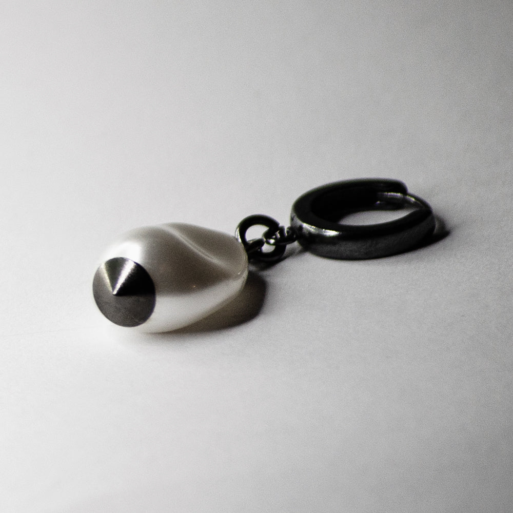 Baroque Pearl Drop earring - tear drop pearl on silver hoop clasp on neutral surface