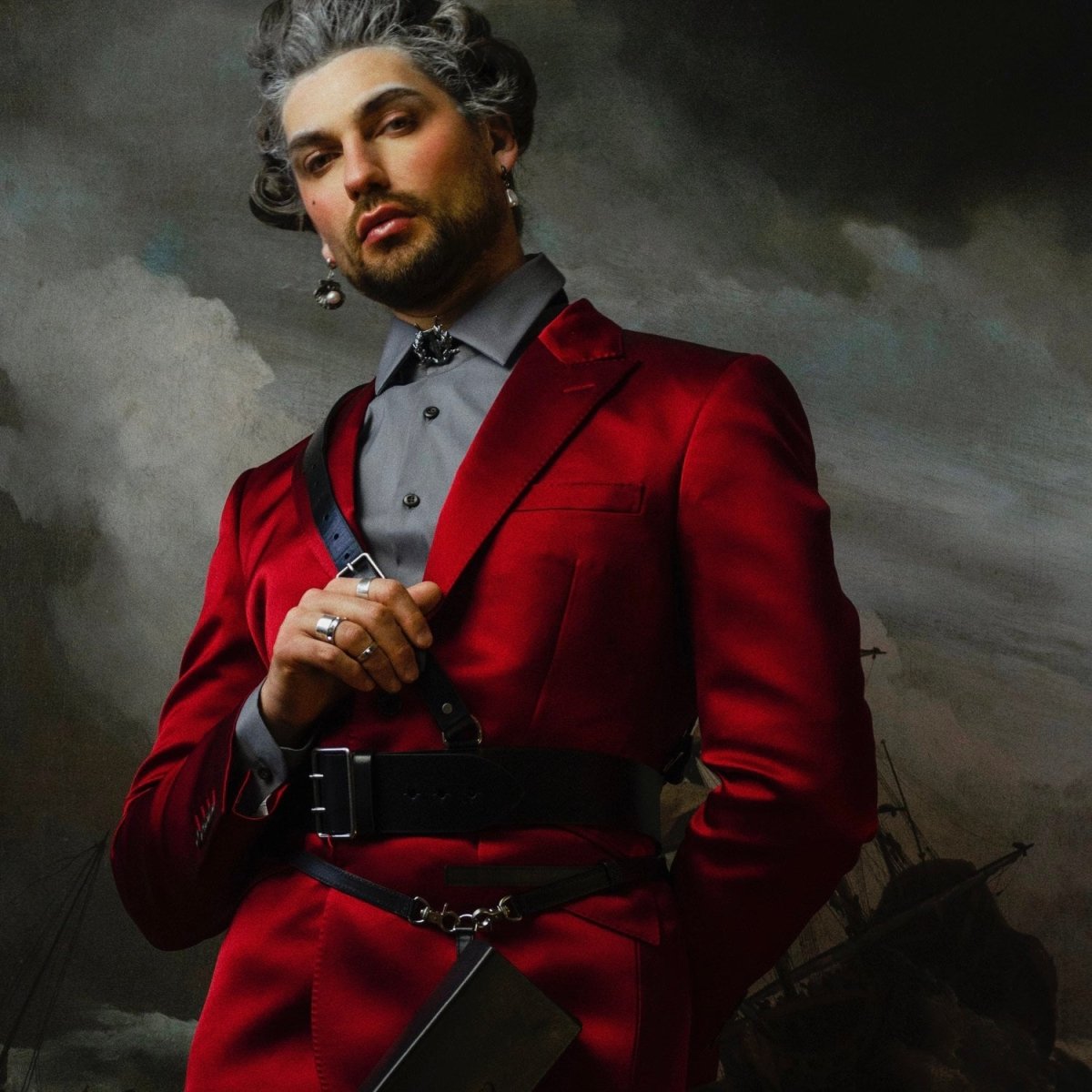 Male model wearing Baroque Pearl Drop earring along with other jewelry by Macabre Gadgets, fashion editorial