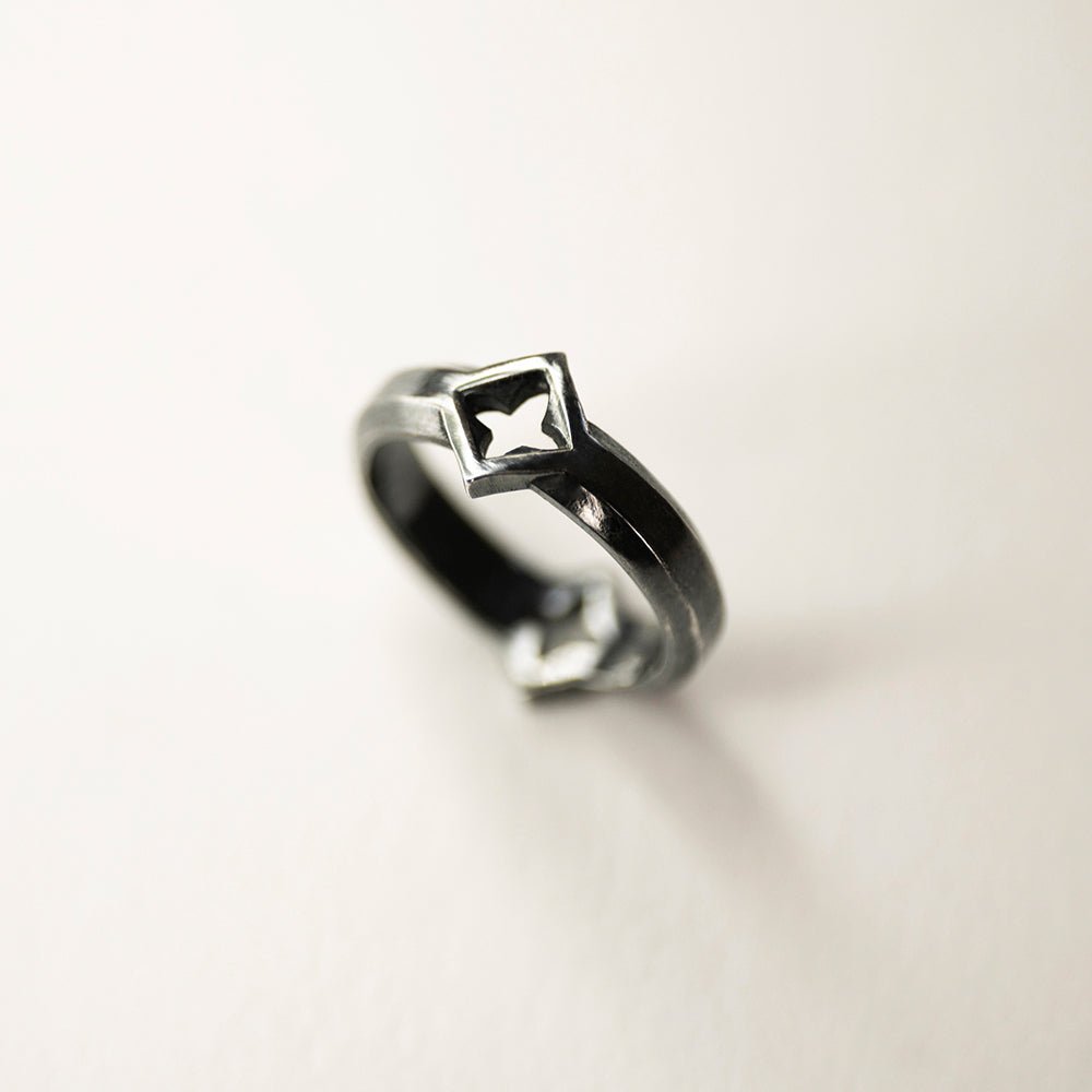 Gothic Clover Ring on white surface 