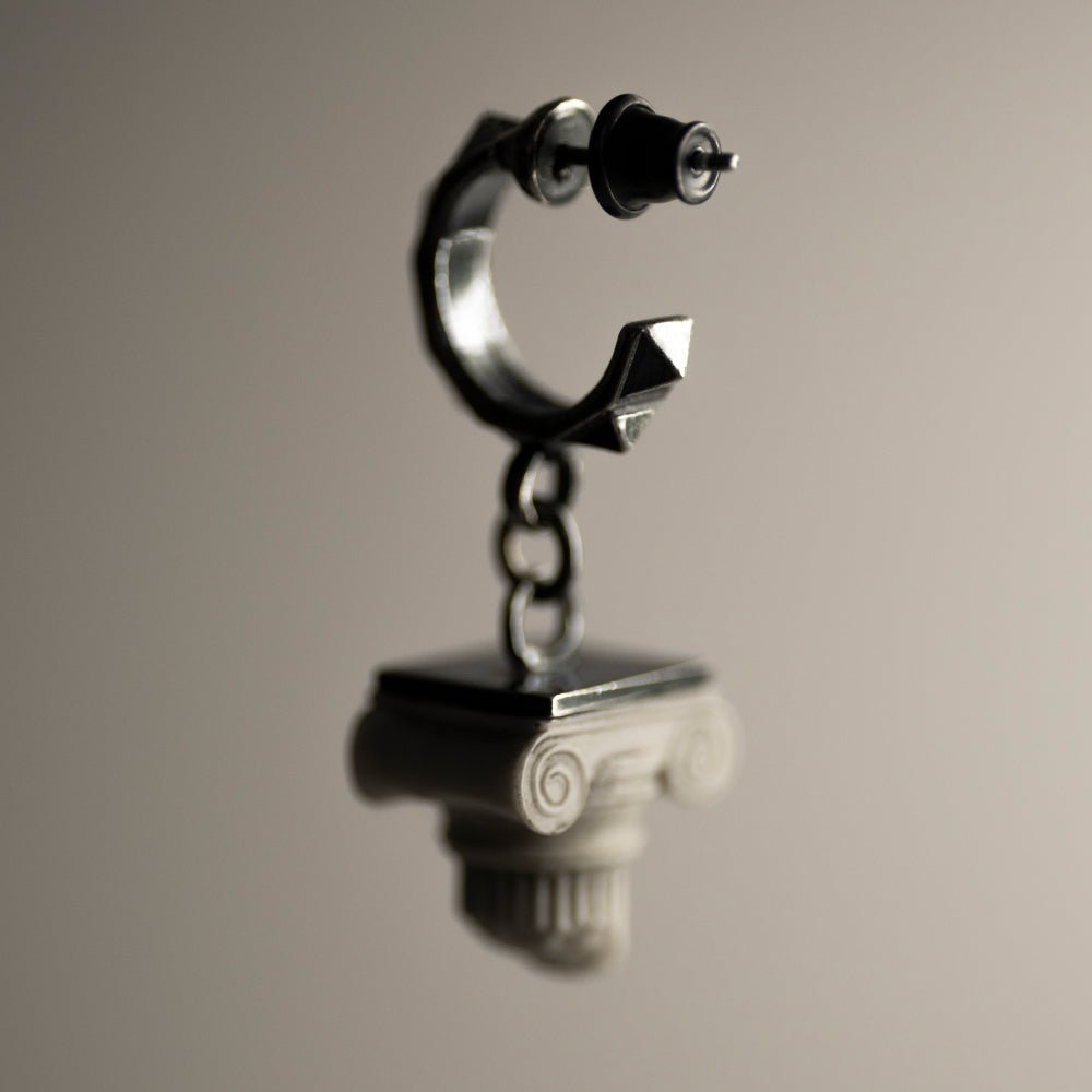 Ionic earring - column shaped earring on a stud lock on neutral background