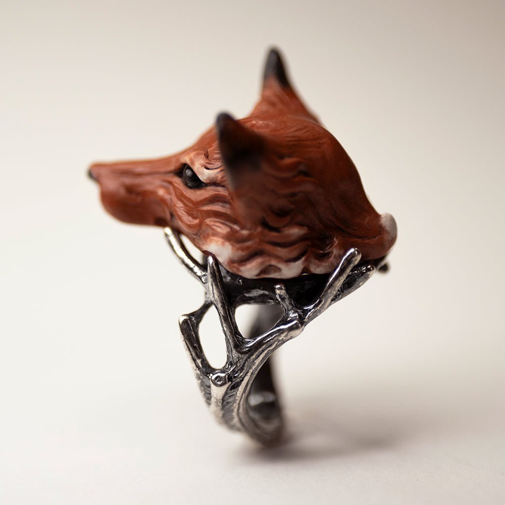 Fox ring - orange variant - semi side view from the back, shows twigs details, and fox's sculpted fur texture 