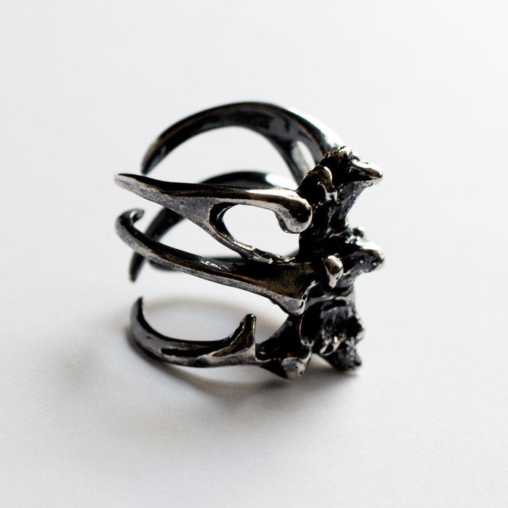 Gills Ribs ring - sterling silver ring resembles rib cage with Art Nouveau influence on white surface