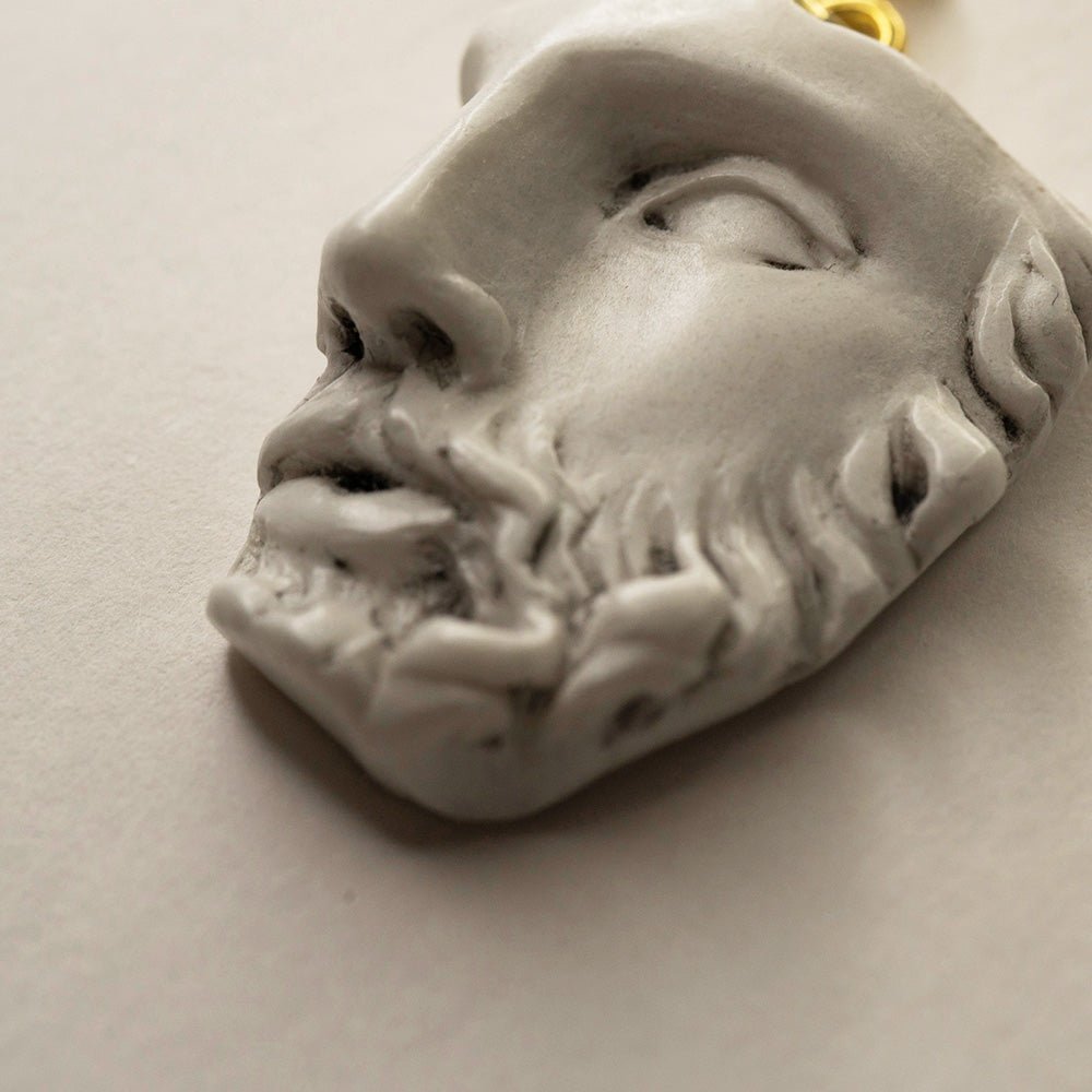 Heracles earring - close-up of marble fragment detail, demonstrating the texture and details of the sculpted earring