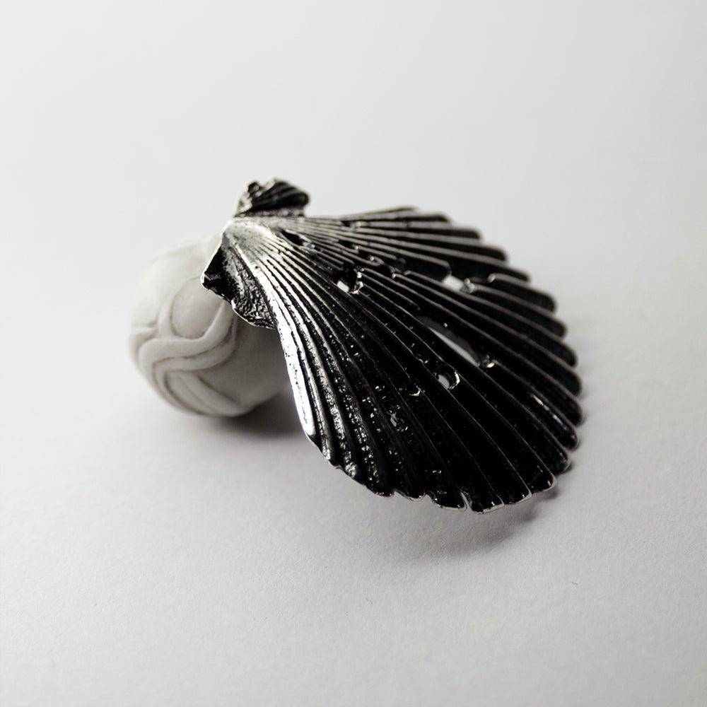 Large Seashell stud earring - sterling silver seashell-shaped earring with stud lock mechanism on neutral background