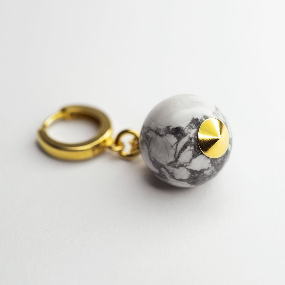Marble Sphere earring - round natural stone bead on hoop clasp placed on white surface
