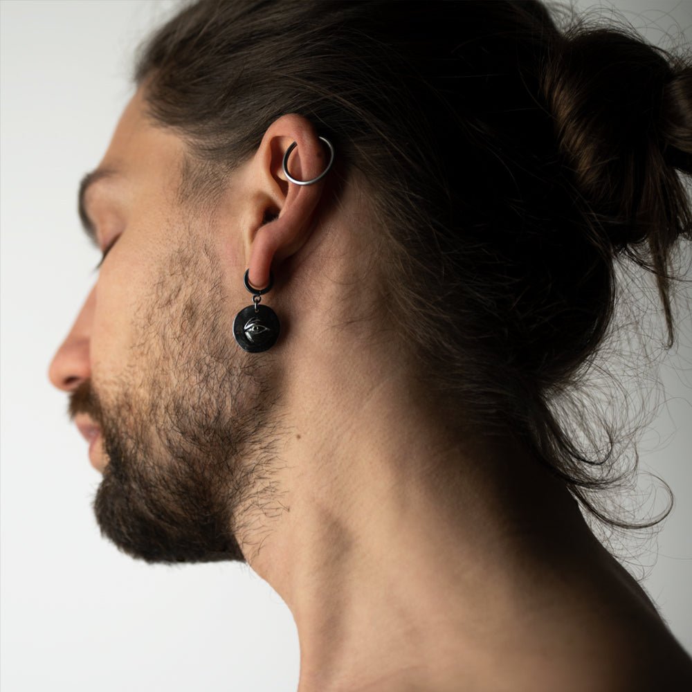 Male model wearing Oculus eye earring - sterling silver coin hoop earring 