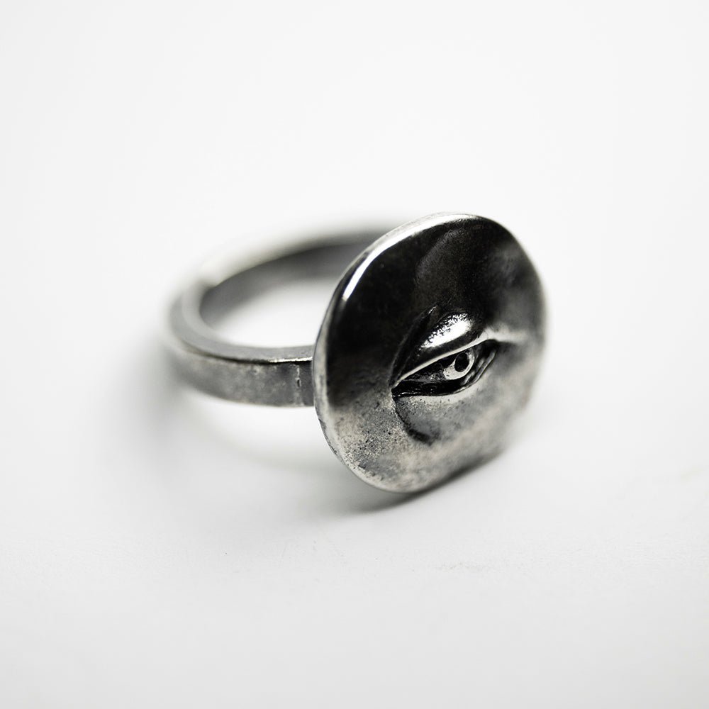 Oculus ring - semi side view, placed on a white surface, demonstrates overall appearance of the ring