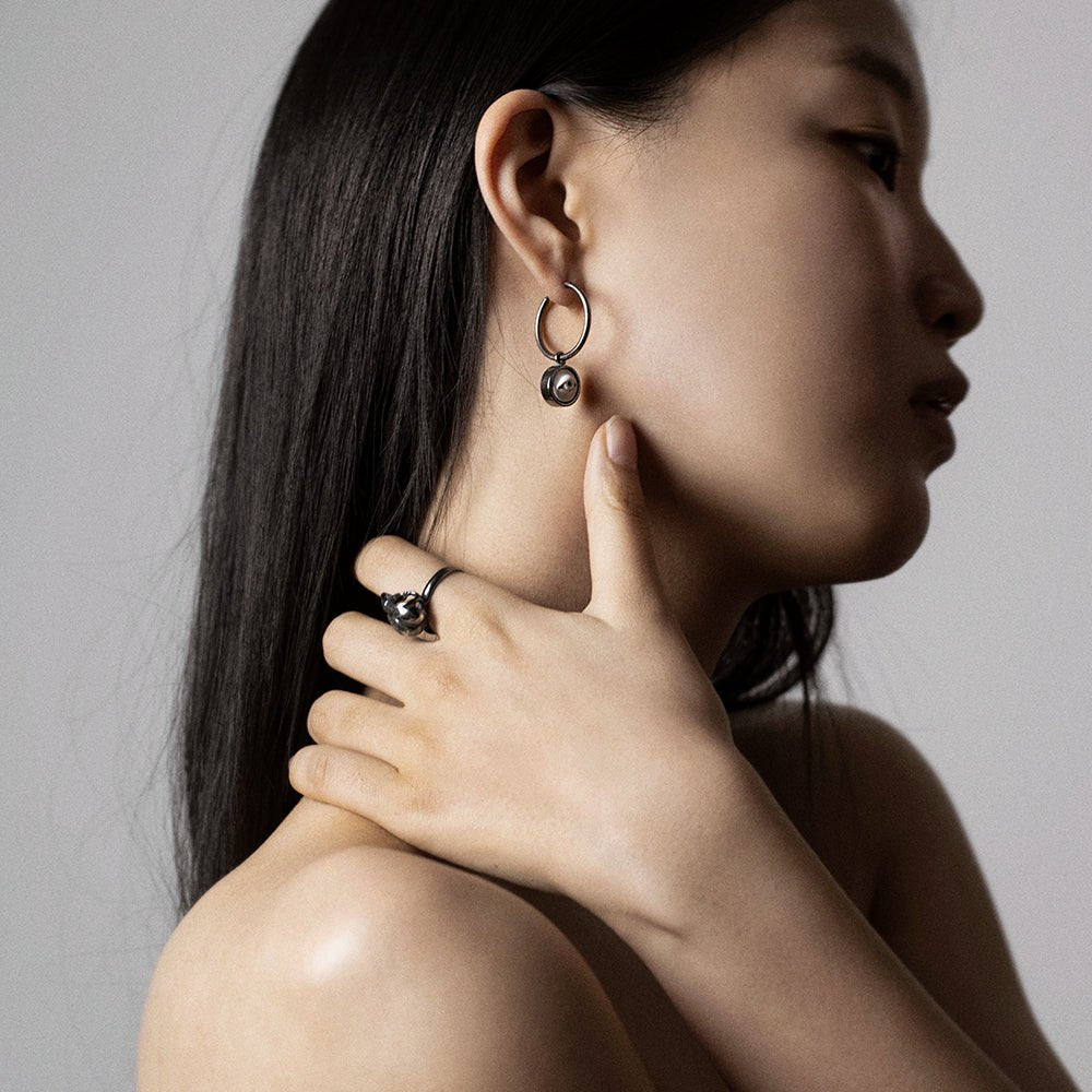 Female model wearing Oracle eye earring - sterling silver gothic eye earring