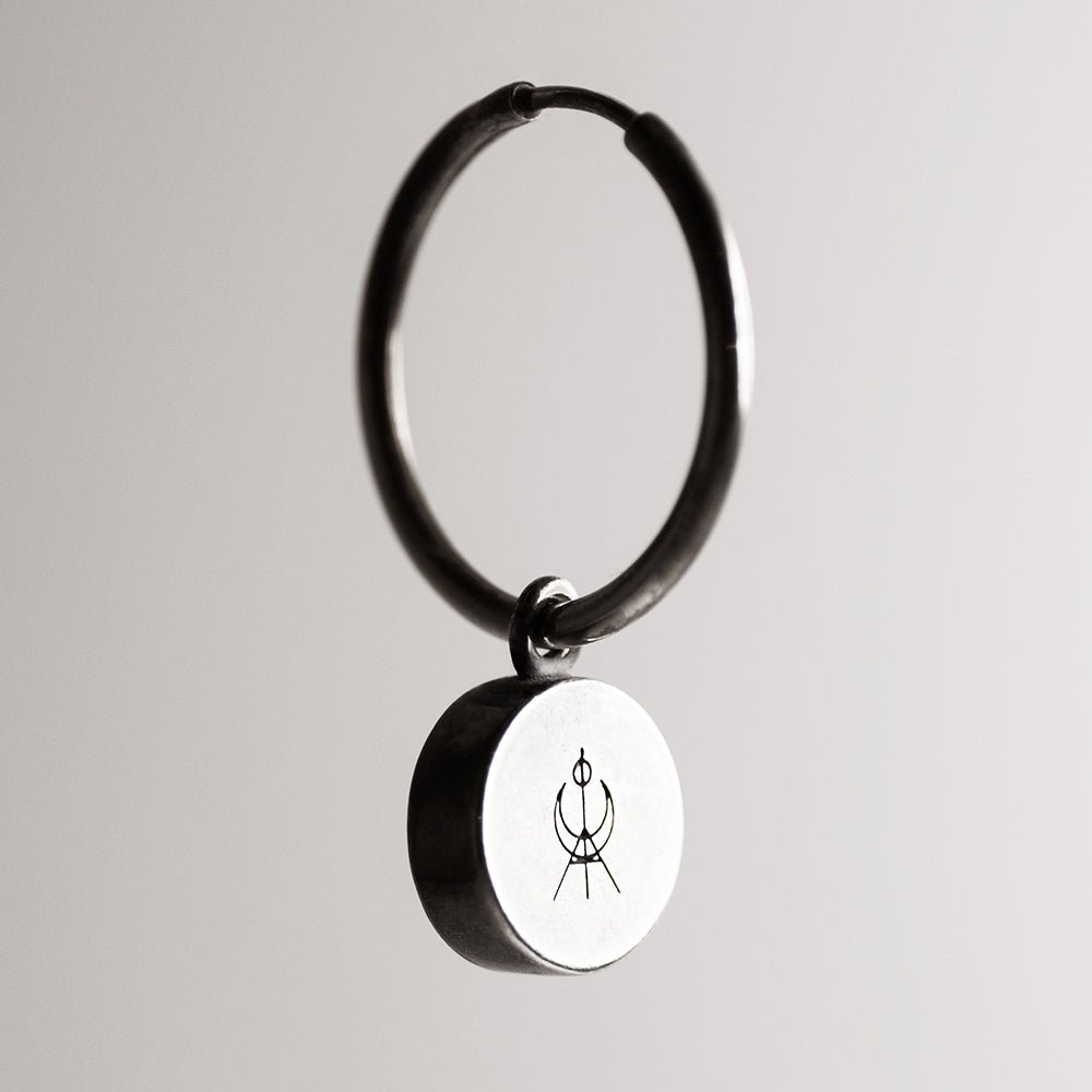Oracle eye earring - demonstrates the back side of the bezel holder with Macabre Gadgets logo on it