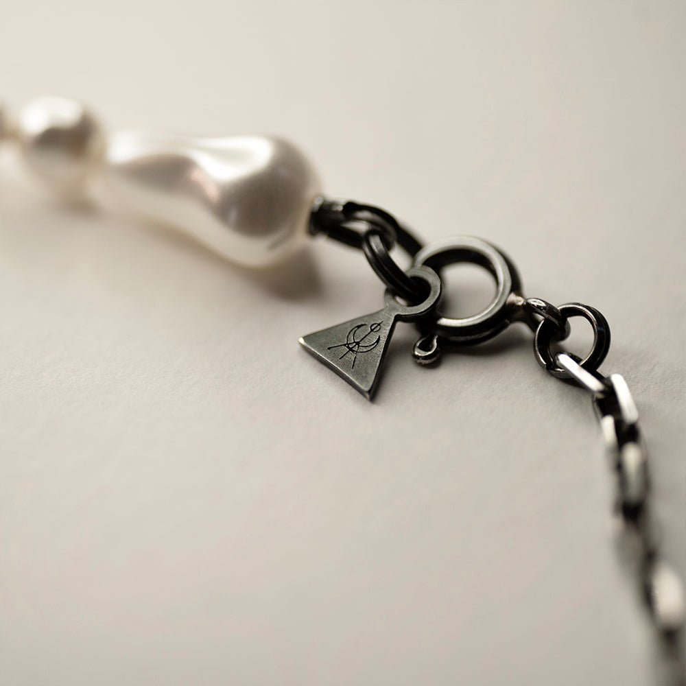 Pearl Drops choker by Macabre Gadgets, close-up of lobster clasp and sterling silver logo detail