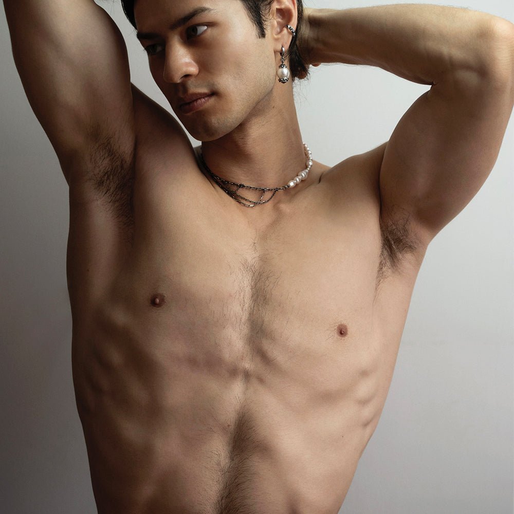 Pearl Drops Choker on a male model styled with pearl earring by Macabre Gadgets