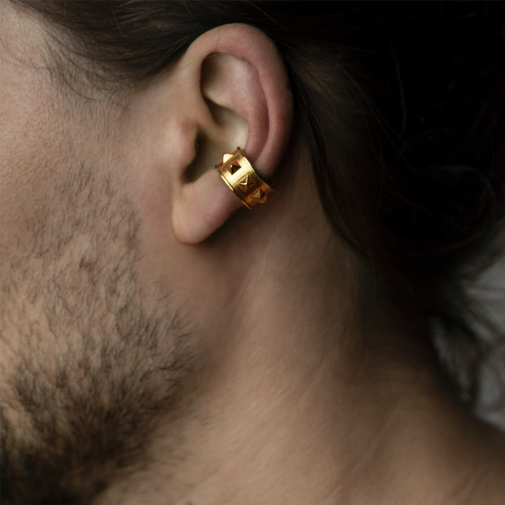 Male model wearing Wide studs ear cuff in gold-plated finish, chunky earring styling shot