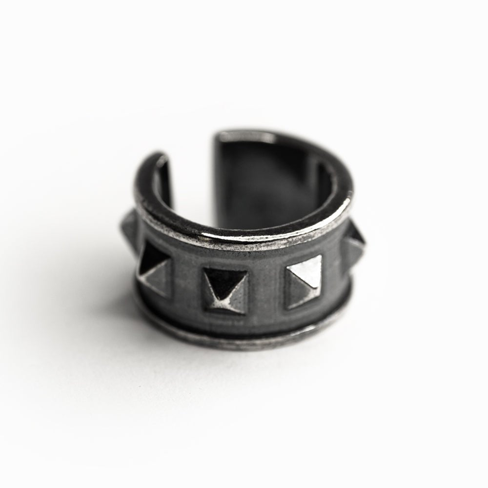Wide studs ear cuff - gothic sterling silver ear cuff with studs on white surface