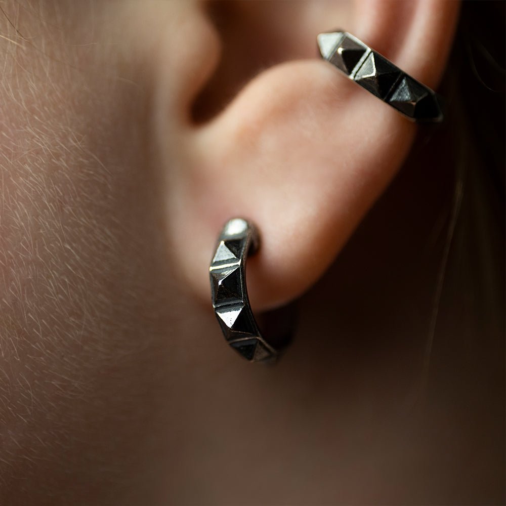 Studs Hoop earring and Stud Hoop ear cuff on a model's ear, close-up 