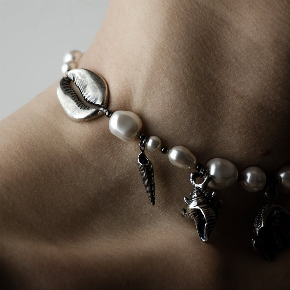Silver Shells and Pearls choker - close-up of the necklace on a model, with shell details clearly visible