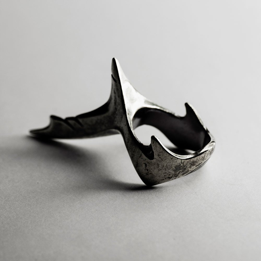 Shark Tail ring - siren-core gothic sterling silver ring on neutral surface