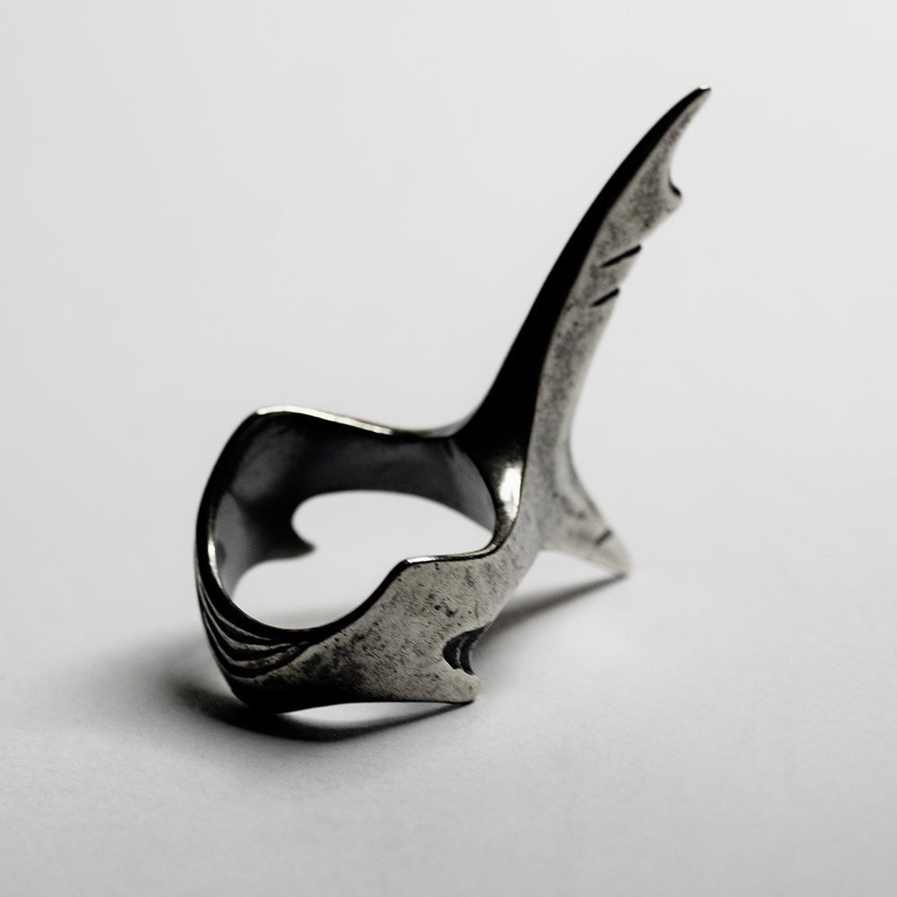 Shark Tail Ring - mermaid-core silver ring on white surface 