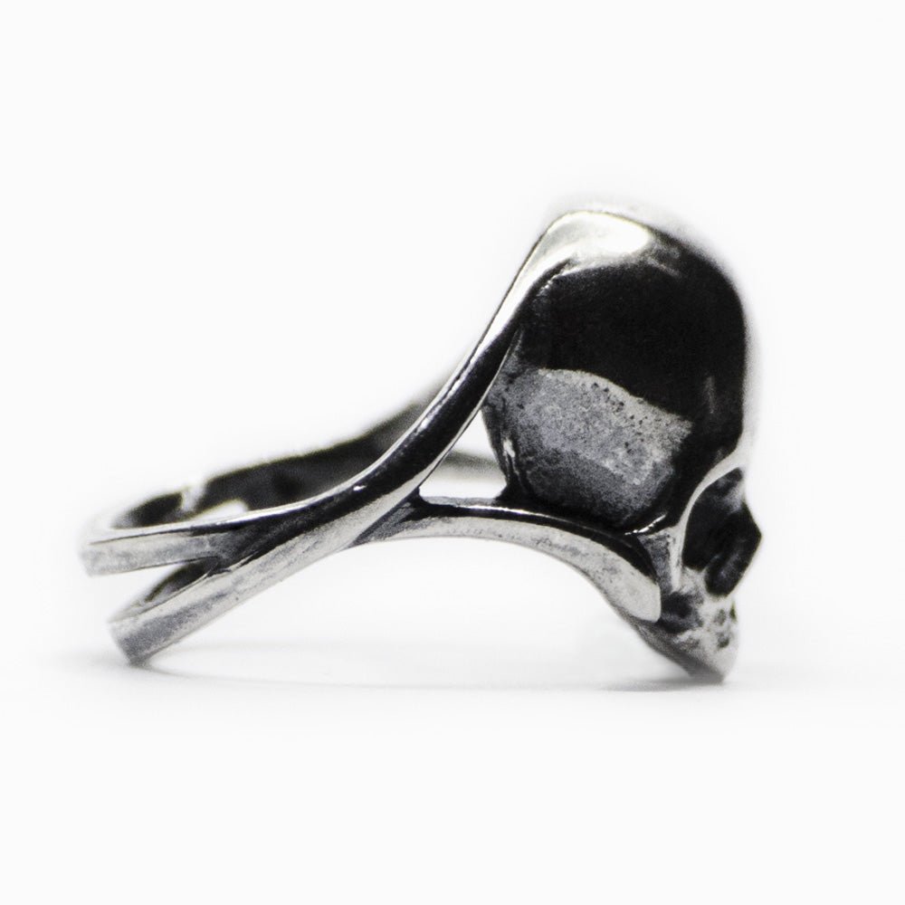 Silver skull ring - profile view, close up of the skull's connection to the ring band
