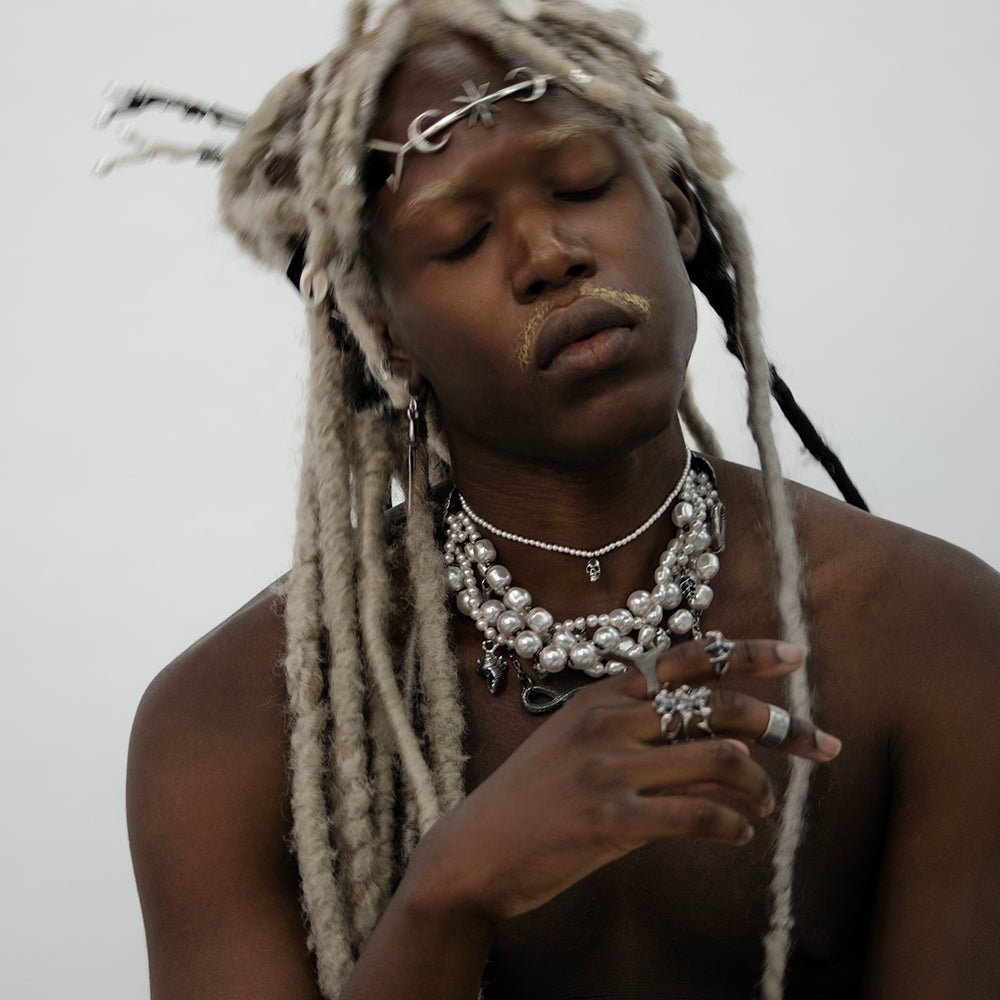 Siren Pearl Necklace on a male model with long white dreadlocks, fashion editorial