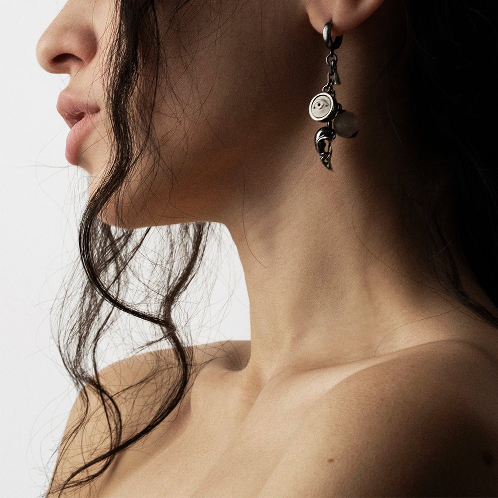 Female model wearing Woods Charm earring - gothic sterling silver earring