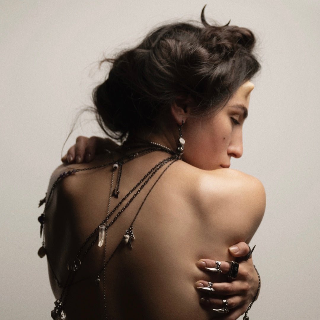 Female model wearing Woods Charm earring in ad campaign for Macabre Gadgets "Faun" collection